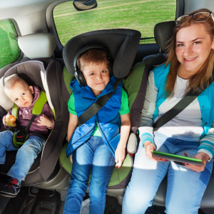 A family enjoys a sunny road trip in their car